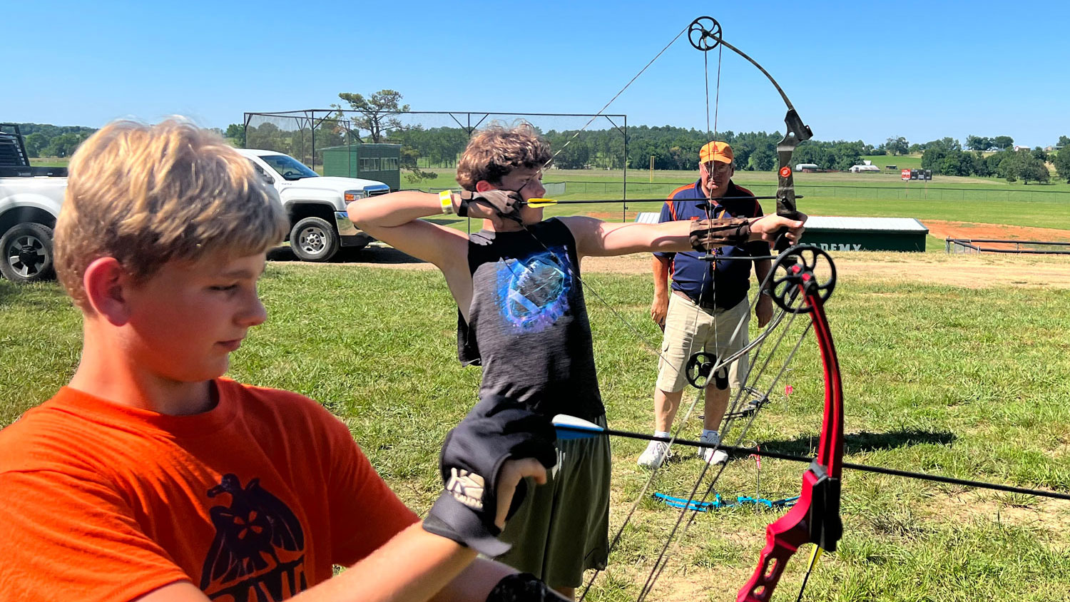 camp subiaco staff at the archery range