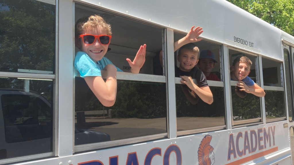 Campers Waving from Bus - Camp Subiaco
